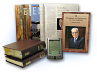 Collection of church publications and a handheld device.